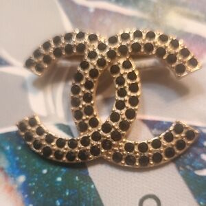 Goldtone and Black Crystal Brooch